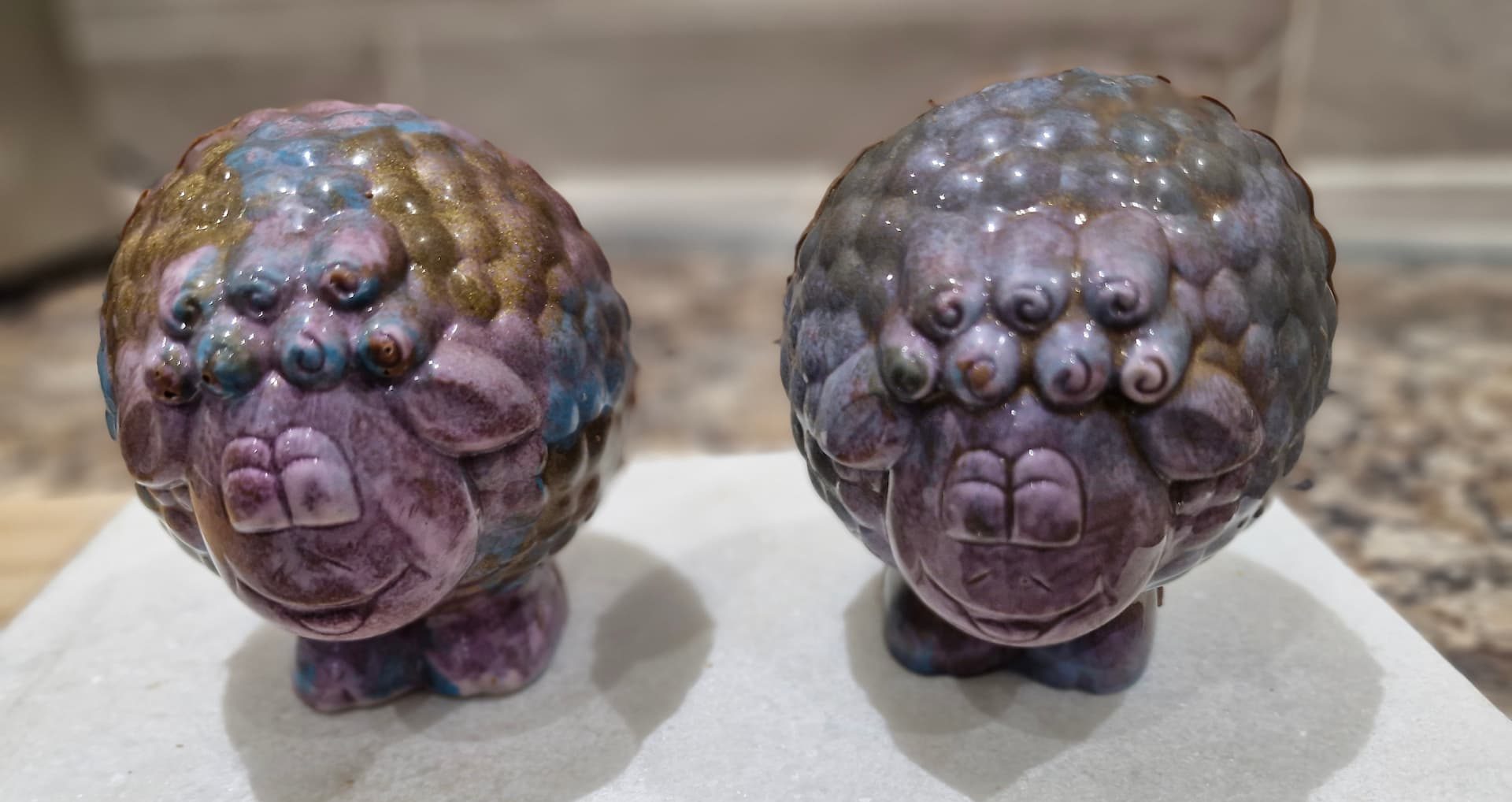 two purple and gold objects